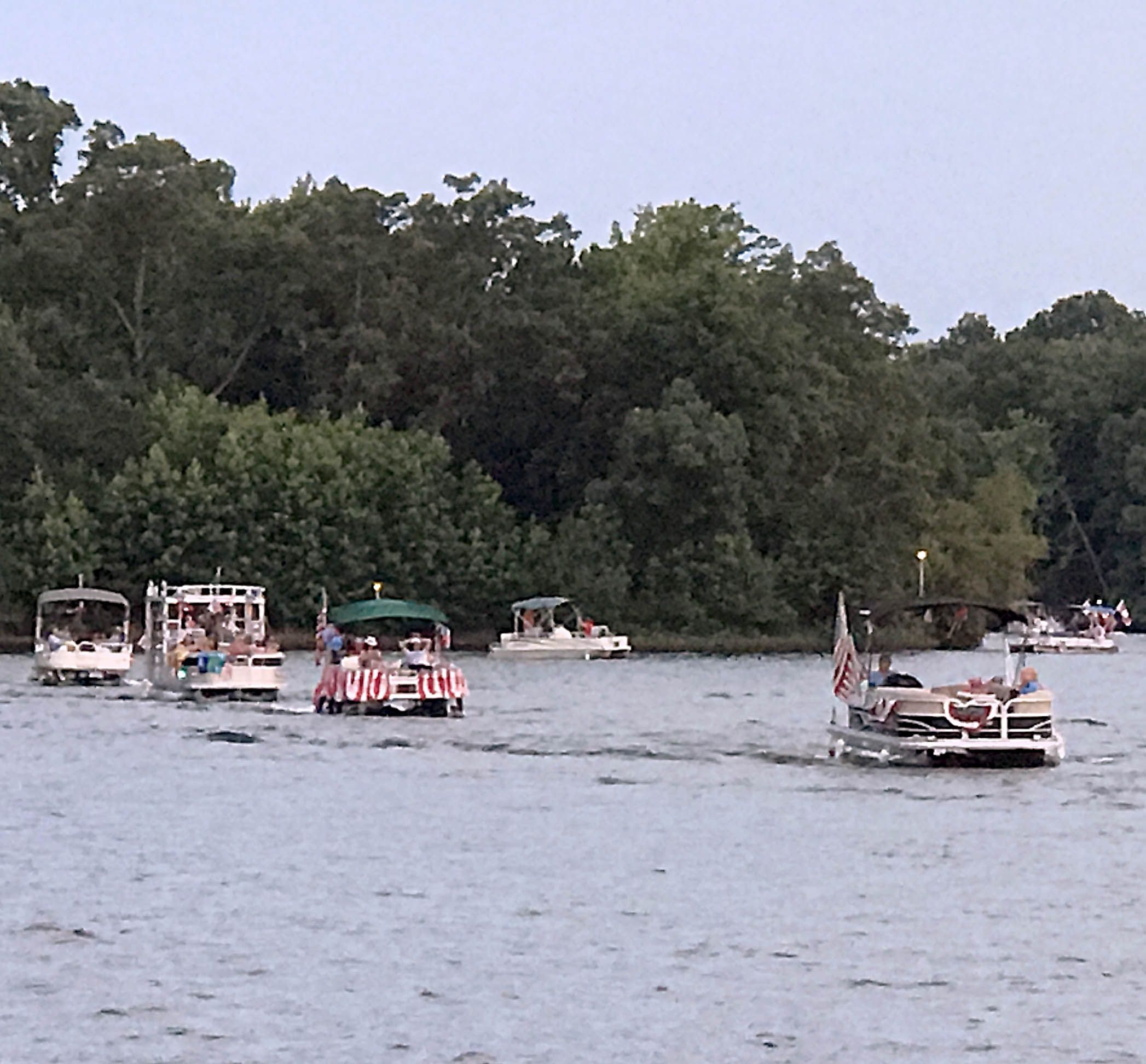 Pontoon Boats forming a parade on Garner Lake in Lakeland TN