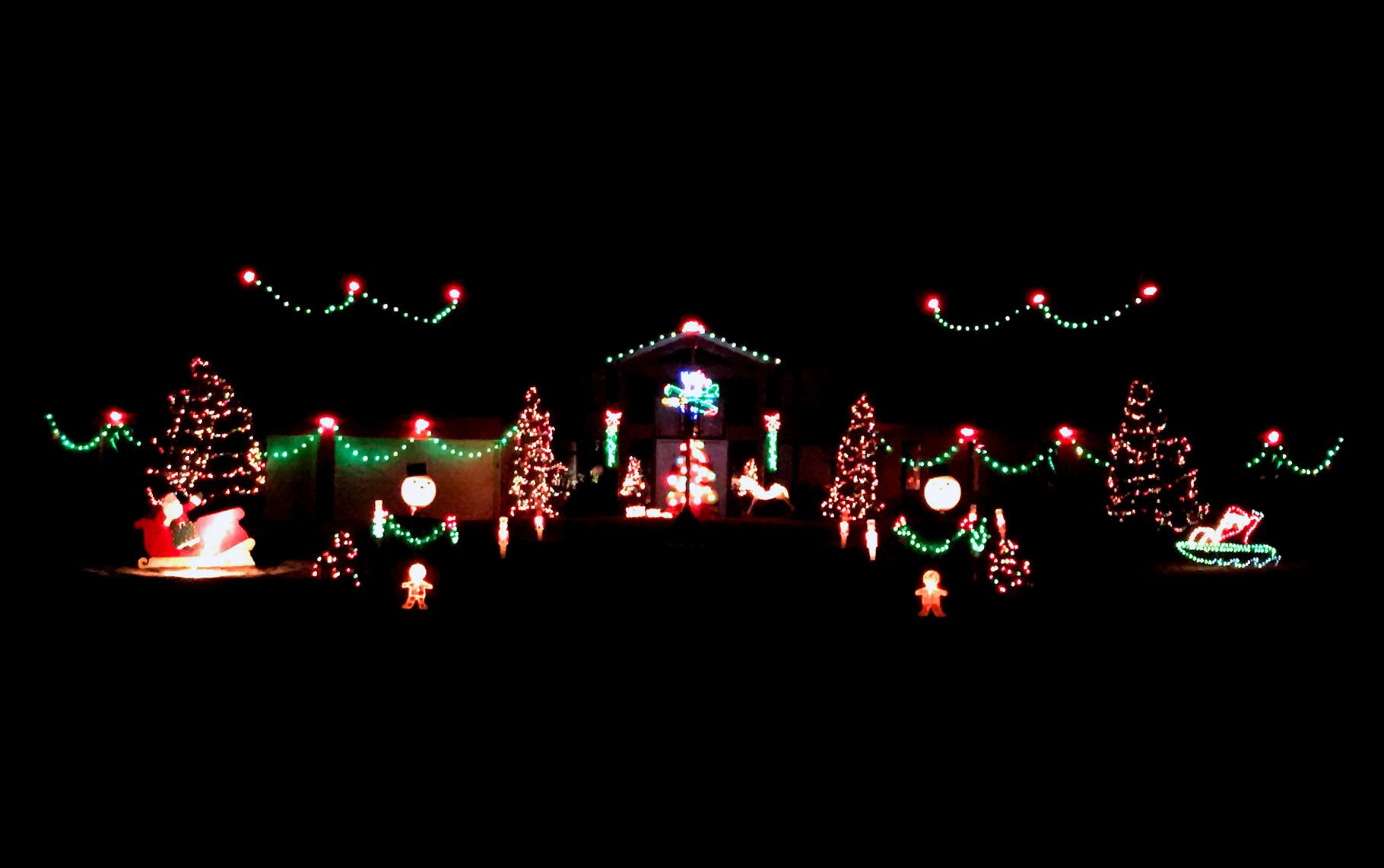 Christmas Lights on front of a house on Garner Lake